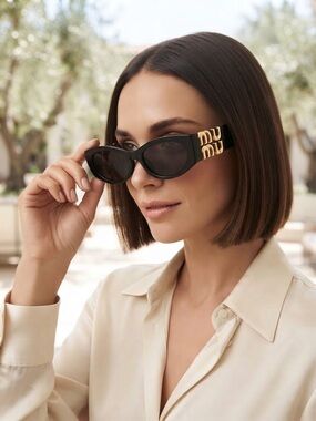 Miu Miu Black chunky oval
Sunglasses • 100% UV Protection 
Tinted gray lens NIB